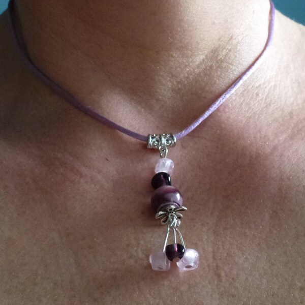 Pendant handcrafed parmes and purple on purple rat tail cord pink,