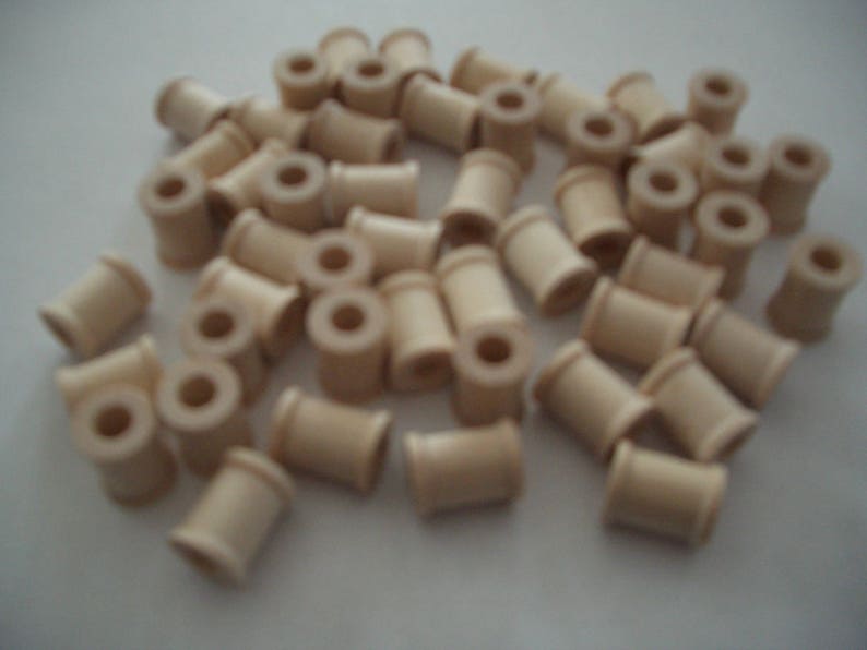 58 0.7 cm 1.5 cm 1.3 cm high Each is 12 hole in diam. with a 14 25 Unfinished Wood SPOOLS for Crafts and Toy or Game parts