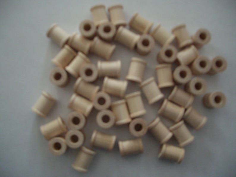 58 0.7 cm 1.5 cm 1.3 cm high Each is 12 hole in diam. with a 14 25 Unfinished Wood SPOOLS for Crafts and Toy or Game parts