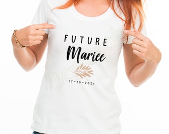 May include: White t-shirt with black text that says "FUTURE Mariée" with a brown leafy branch design and the date "17-10-2021" underneath.