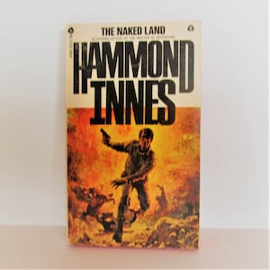 THE NAKED LAND by Hammond Innes (First Avon Printing, 1971)