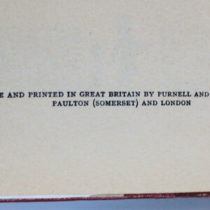 May include: A book with the text "MADE AND PRINTED IN GREAT BRITAIN BY PURNELL AND SONS, LTD., PAULTON (SOMERSET) AND LONDON" printed on the back cover.