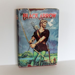 May include: A vintage paperback book cover featuring a colorful illustration of a man with a bow and arrow. The book title is "The Black Arrow" by R.L. Stevenson.
