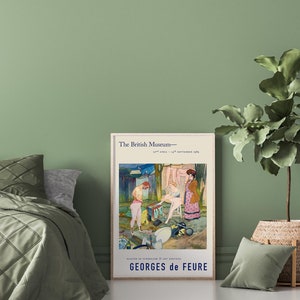 May include: A framed poster from The British Museum featuring a Georges de Feure painting. The artwork depicts figures in a colorful outdoor scene. The poster is displayed on a green wall next to a bed and a potted plant.