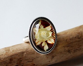 hallmarked 925 silver ring with genuine Royal amber hand carved stone