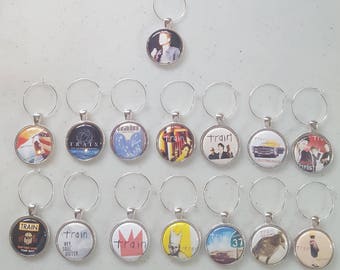 The band Train wine charms set of 6, you choose. Pat Monahan, music, Drops of Jupitor, Soul Sister...