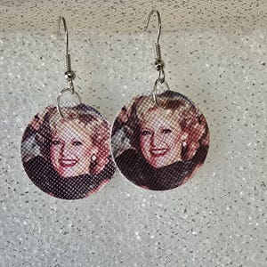 Golden Girls dangle faux leather earrings.