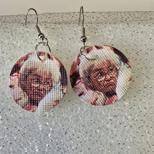 Golden Girls dangle faux leather earrings.