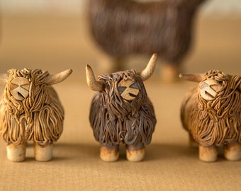 Small pottery highland cow