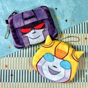 Llaveros de Transformers Minky - Monedero - 10 cm - Starscream y Bumblebee