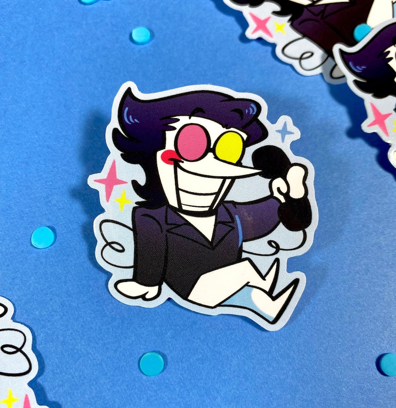 May include: A cartoon character with black hair, a black suit, and a white shirt is holding a black phone. The character has pink and yellow eyes and a wide smile. The background is blue with white stars.