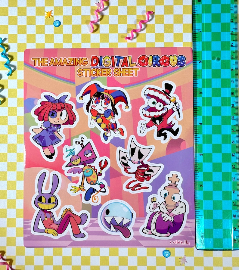 May include: A sticker sheet featuring characters from the "The Amazing Digital Circus" game. The sheet includes a jester, a mouth with teeth, a robot, a ghost, a king, and a rabbit. The sheet is pink and purple with a checkered background.
