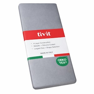 May include: A rectangular, silver-colored product package with a red and white label. The label reads "tivit" and lists features like "4 Layer Construction" and "Metallic Silicone Coated." The package is marked "MADE IN ITALY" and has an OEKO-TEX logo.