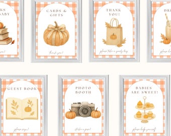 May include: Nine pumpkin-themed baby shower signs, each framed in white. The signs feature watercolor illustrations of pumpkins, books, gifts, drinks, food, and more. The signs are 8x10 inches and are editable.