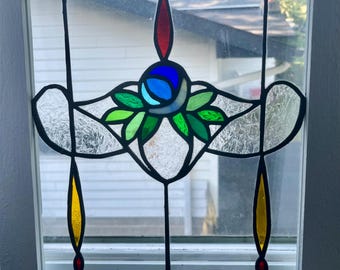 Victorian stained glass window panel remade with handmade rustic wood frame.