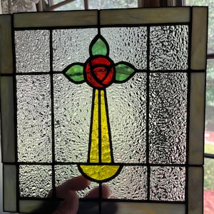 Square stained glass window panel with vintage MacIntosh rose flower.