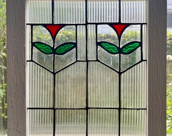 Country style stained glass window panel with simple red tulip flowers