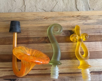 Three Vintage Bottle Stoppers ~ Two MCM Acrylic Flame Design Bottle StopperYellow and Green ~ One Blown Glass yellow and orange Stopper