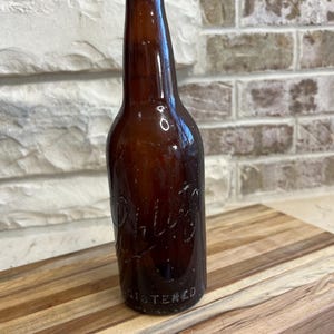Vintage Schlitz Beer Bottle - Embossed Amber Glass | Antique Brewery Collectible, Rustic Bar Decor, Breweriana