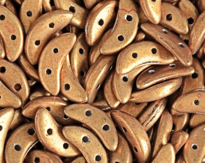 Gold metal Czechmates Crescent 2 holes saturated