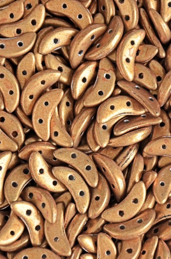Gold metal Czechmates Crescent 2 holes saturated