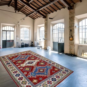 Handmade Kazak Rug: Geometric Caucasian Wool Rug (5.5x9 ft)