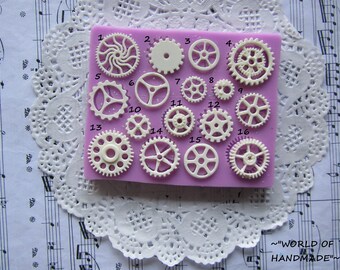 Silicone molds in the form of gears of different shapes and sizes. Molds for polymer clay and plastics.