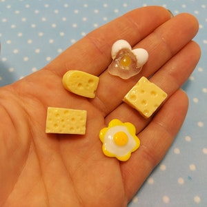 Silicone molds in the form of miniature Eggs and Cheese of various shapes and sizes. Molds for polymer clay and plastic.