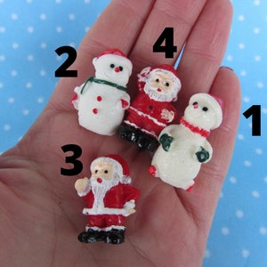 Silicone 3D molds in the form of miniature Snowmen and Santa Clauses. Molds for polymer clay and plastic.