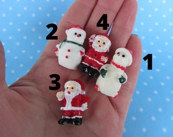 Silicone 3D molds in the form of miniature Snowmen and Santa Clauses. Molds for polymer clay and plastic.
