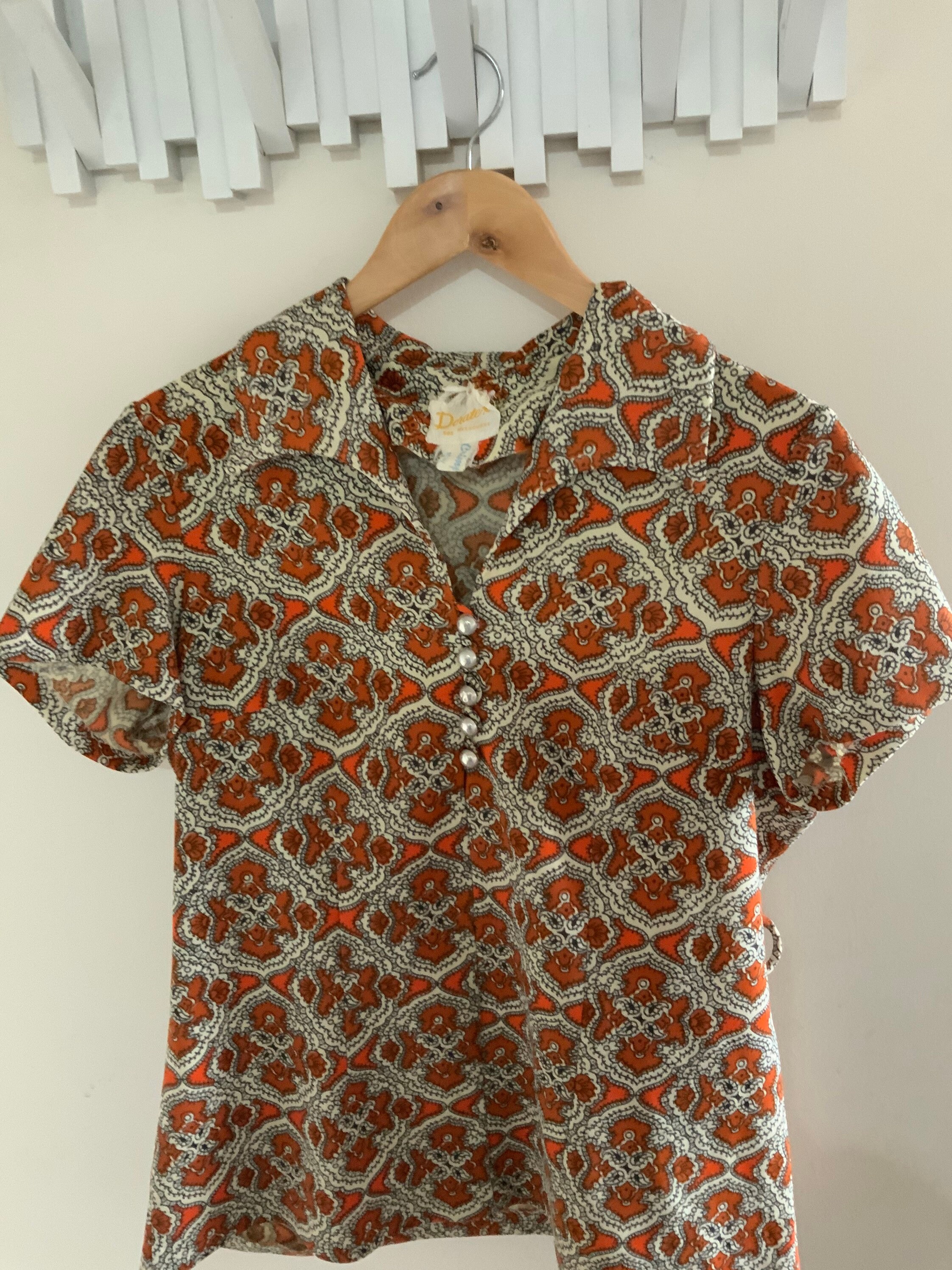 Orange Paisley Shirt With Silver Buttons. Very jan From the Brady Bunch