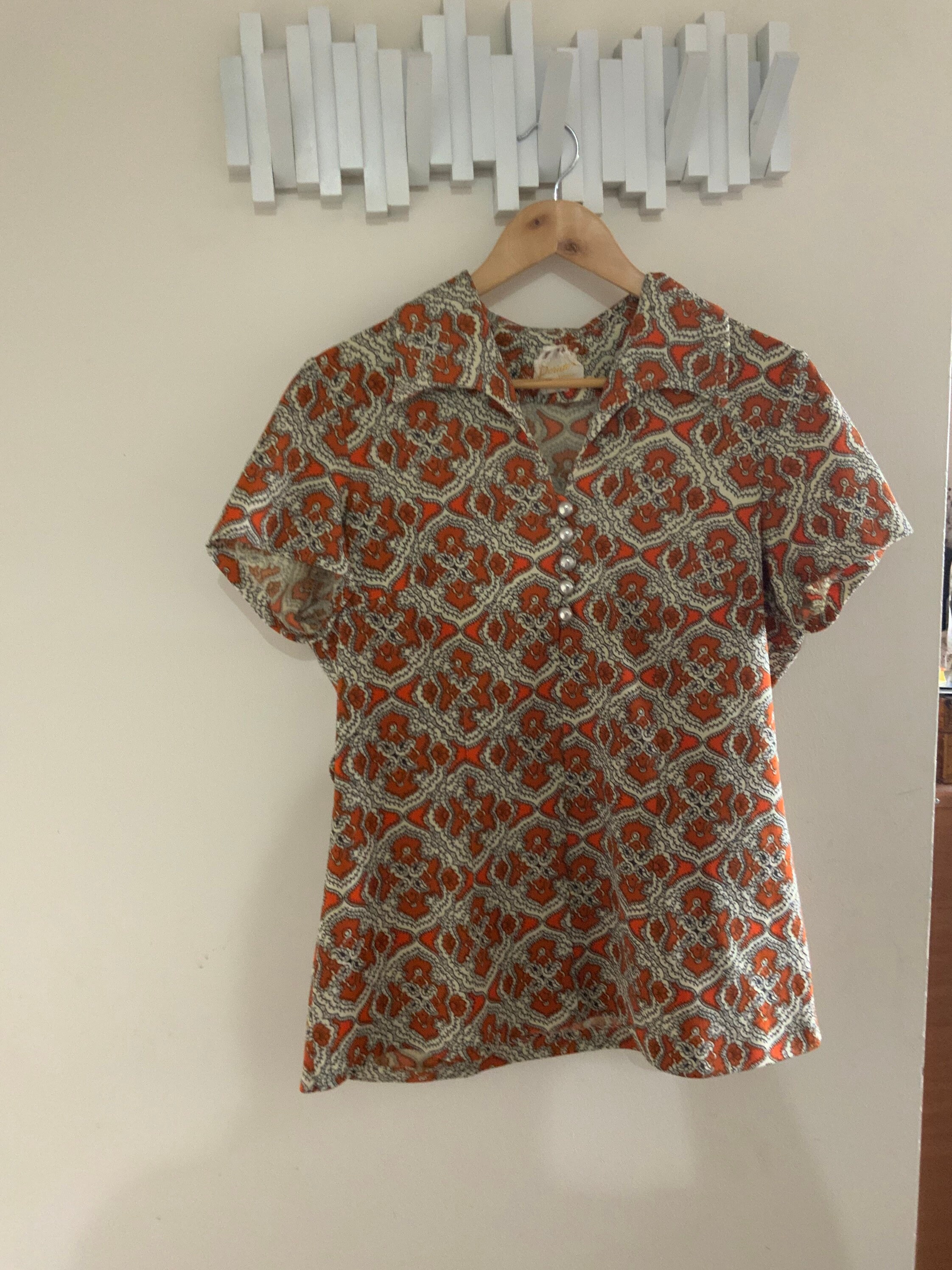 Orange Paisley Shirt With Silver Buttons. Very jan From the Brady Bunch