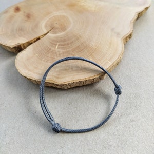 Bracelet réglable en lien synthétique unisexe pour homme et femme Gris