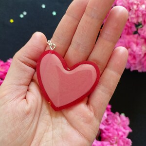 Heart-shaped resin bookmark and chain with charms