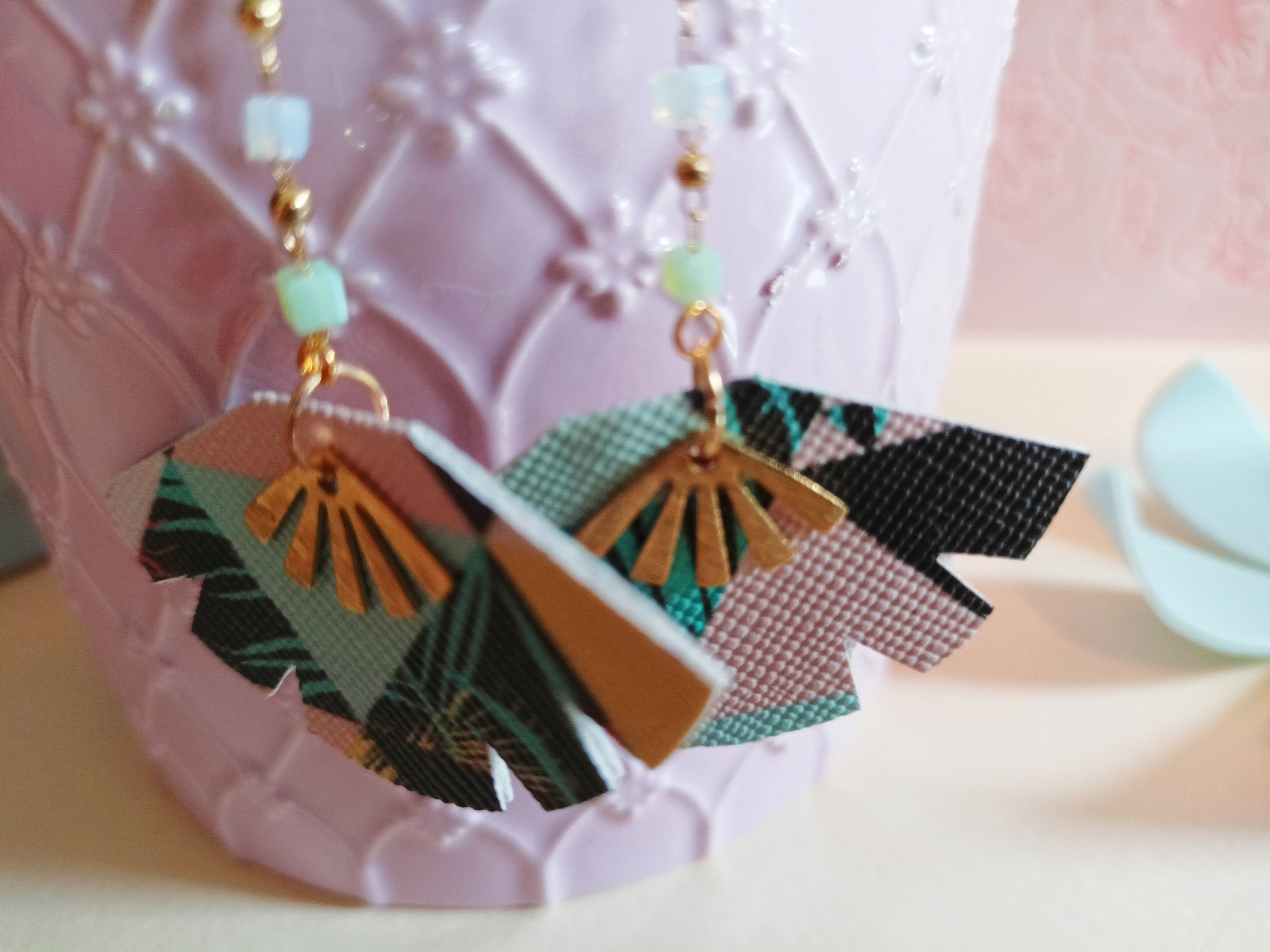 Boho dangling earrings with graphic patterns in pastel colors