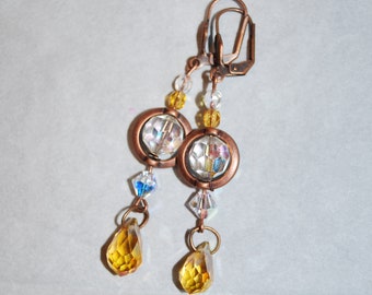 Earrings with Swarovski crystal beads and copper primers.
