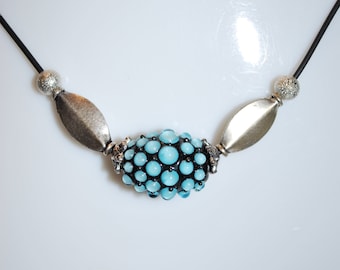 Neck collar with spun glass bead with black and blue blowtorch.