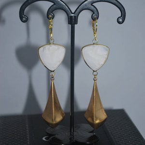 Golden triangle earrings and white glass. image 1