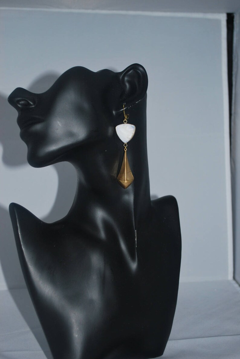 Golden triangle earrings and white glass. image 4