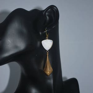 Golden triangle earrings and white glass. image 3