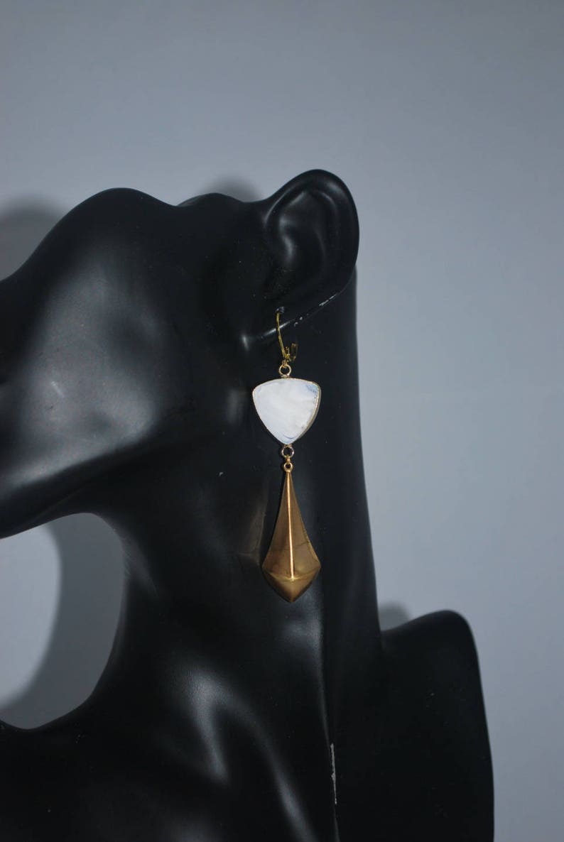 Golden triangle earrings and white glass. image 3