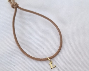 Elastic bracelet with 333 gold initial pendant