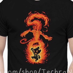 May include: Black t-shirt with a graphic of a fiery creature with a smaller creature inside the flames. The text "etsy.com/shop/TechraNova" is printed on the bottom of the shirt.