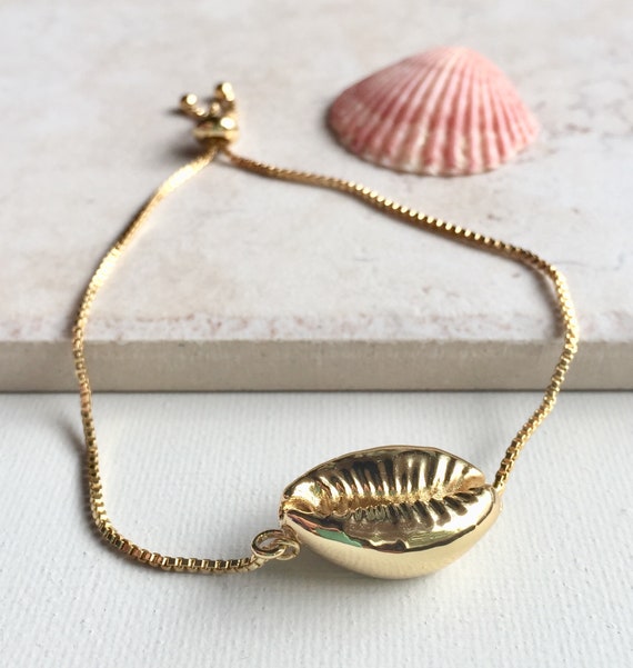 Gold cowrie bracelet best sale