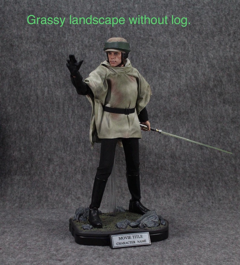 May include: A detailed action figure of Luke Skywalker from Star Wars, wearing a brown and white hooded robe, black pants, and a black helmet. He is holding a lightsaber in his right hand and is standing on a black base with a small plaque that reads "Movie Title Character Name".