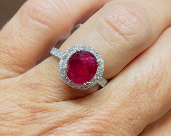 Madagascar Oval Ruby 3.16CT Fine Quality Certified Set In A 18KT White Gold Diamond Halo Ring 1.0CT TW