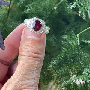 Oval Ruby 2.0CT. and Diamond 1.50CT. TW Vintage Style Halo Platinum Ring.