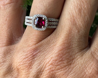 Ruby Oval .81CT. Diamond Halo Ring .75CTS. in 18kt. White Gold