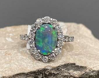 Australian Black Opal 1.57CT. And Diamond Halo Ring 1.0CTS. In 14KT White Gold