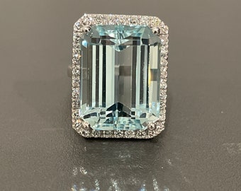 Emerald Cut Aquamarine 18.33CT. And Diamond Halo Ring 1.0CTS. In 14KT. White Gold